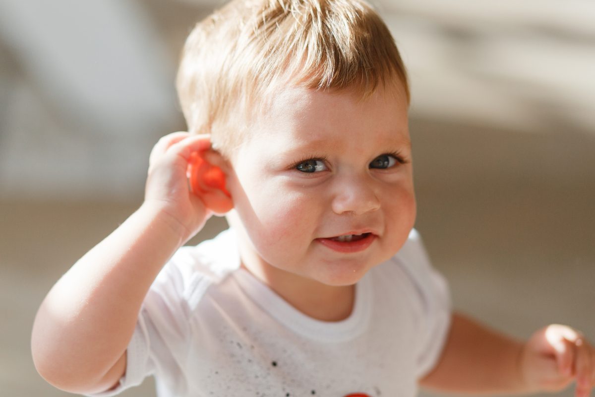 baby boy listens put hand his ear 16773021493x2 s2eQBh