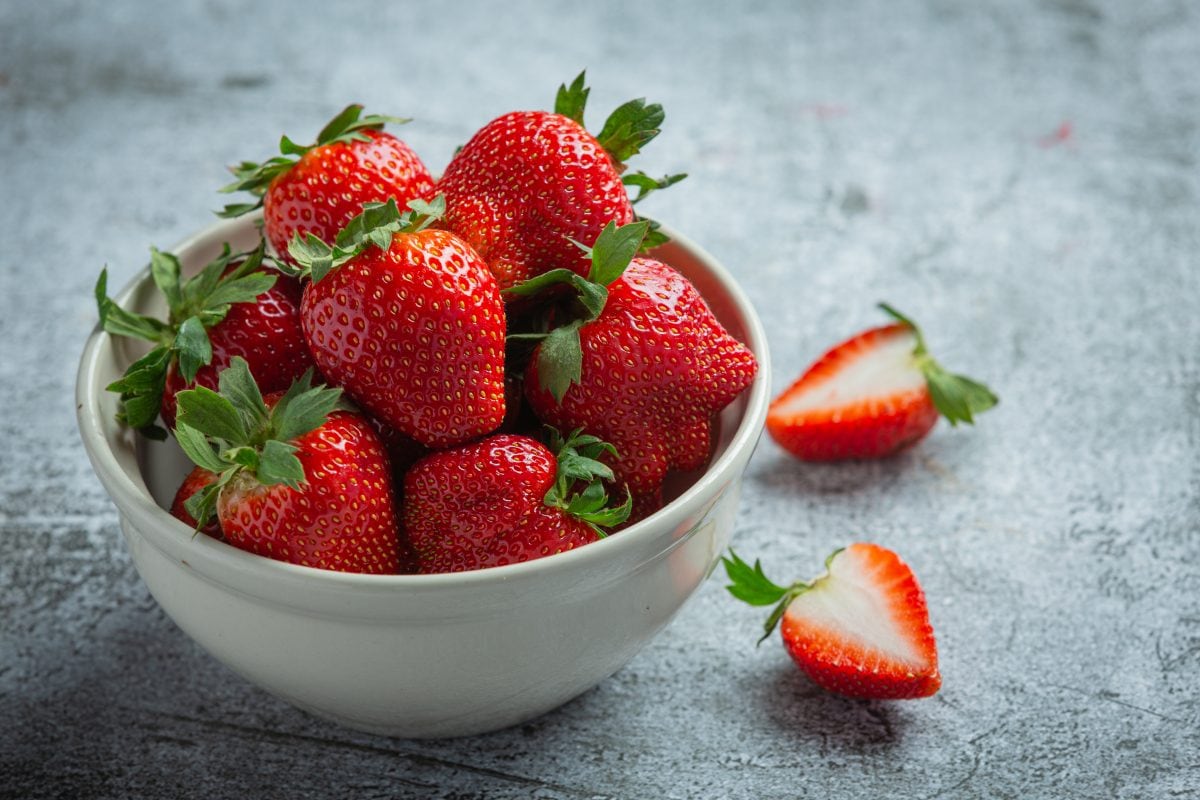 fresh strawberries bowl old dark background 16765201373x2 e3MQEt