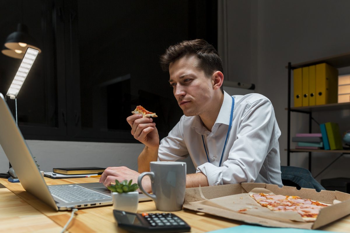 portrait male having snack while working from home 16753412353x2 AwfW5i