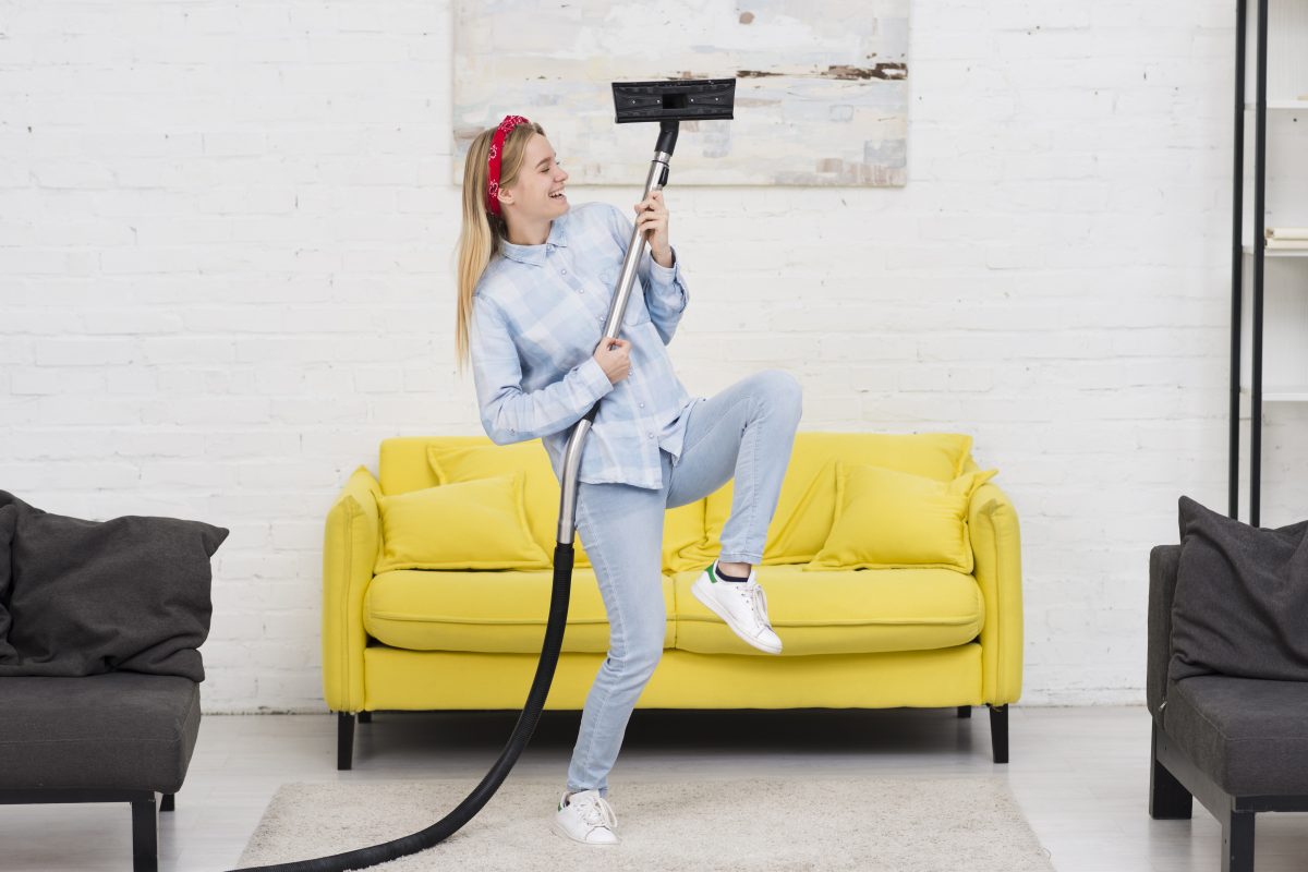 woman doing house chores with vacuum 16765581613x2 q7j7Lw