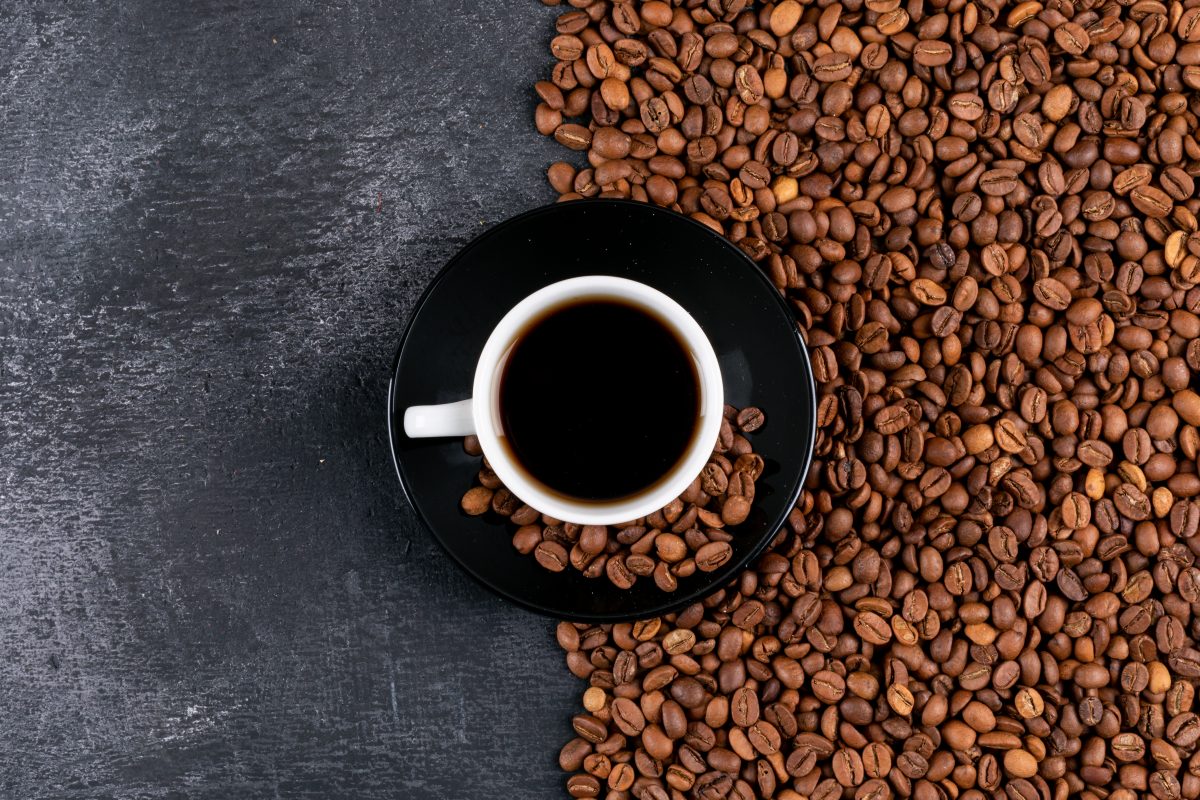 top view coffee cup coffee beans dark table 16763844223x2 1SeiaX